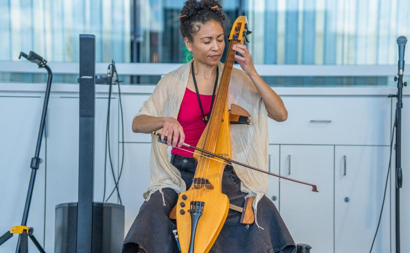 Gretchen Yanover playing the cello at Marketplace in N Concourse. 