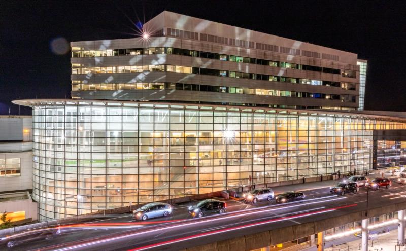 SEA Airport Office Building lit up at night.