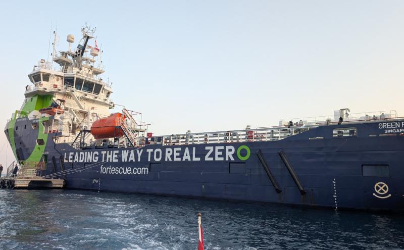 A ship that has 'Leading the Way to Real Zero- fortescue.com' written on its side.