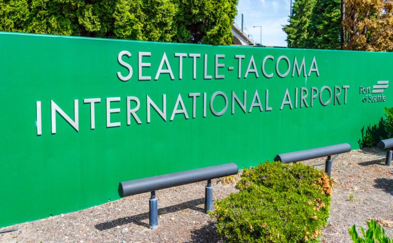 Airport sign reading 'Seattle-Tacoma International Airport'.