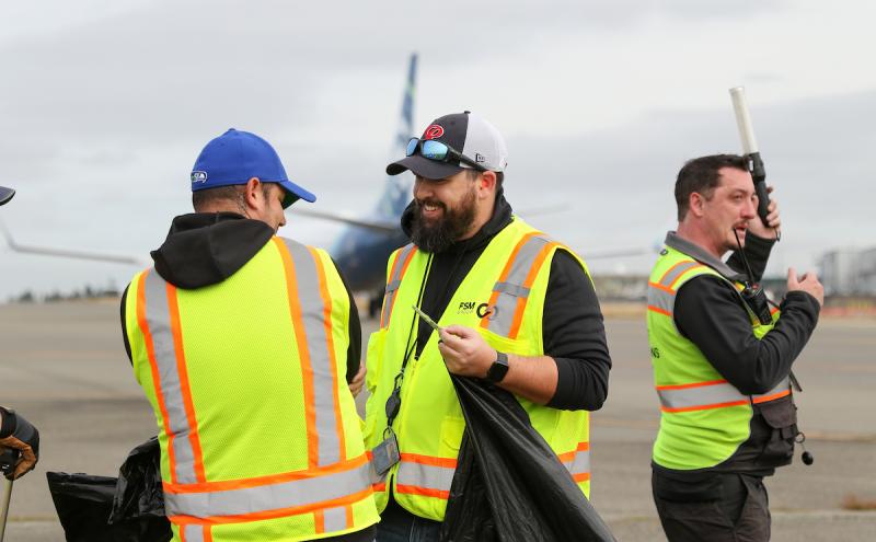 Airport Employees in High Vis Vests.