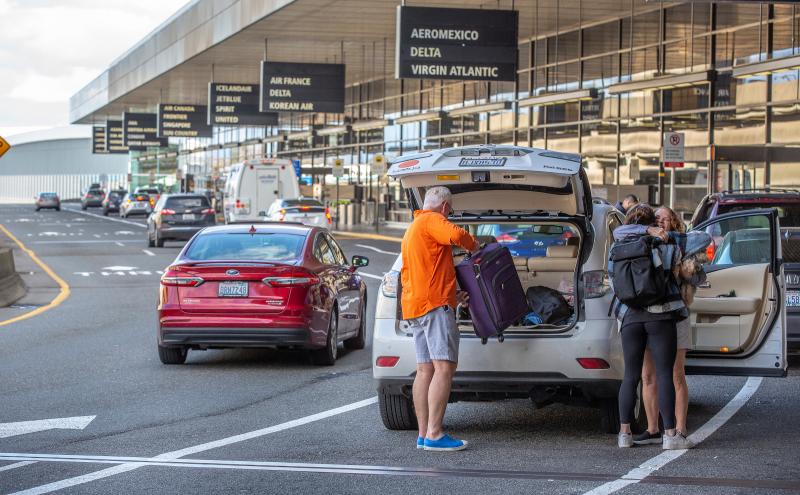 Passengers being dropped off at the terminal.