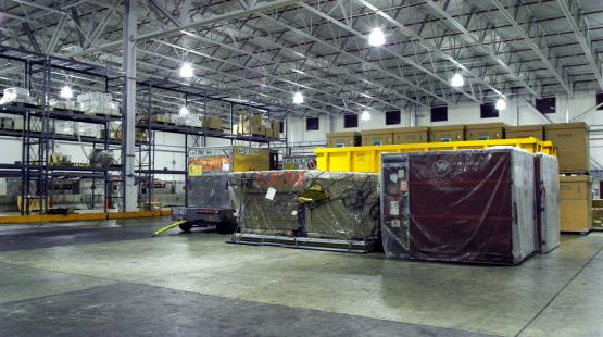 Cargo containers inside of a warehouse.