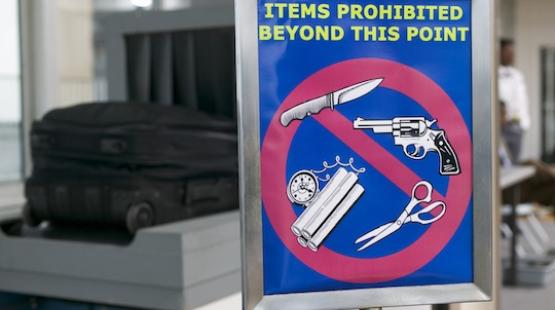 Items Prohibited Beyond this point,  knives, guns, scissors, and explosives. 