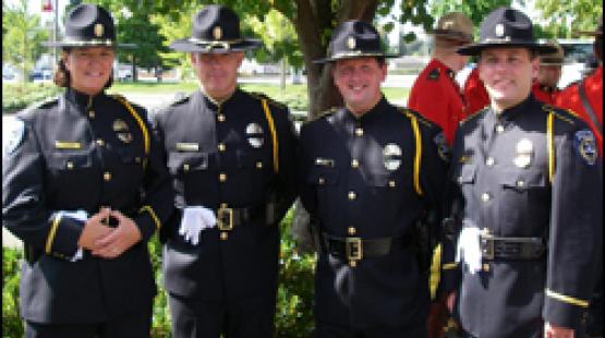 Four honor guard members in uniform.