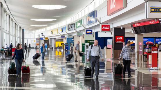 Customers walking around Rental Car Facility.