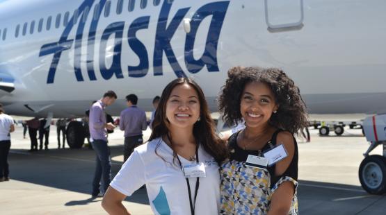 Two interns at a networking event at Sea-Tac airport.