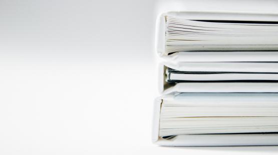 A stack of documents- decorative