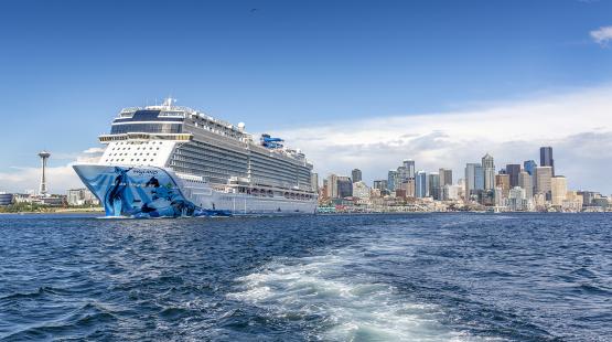 Bliss cruise ship with space needle in background.