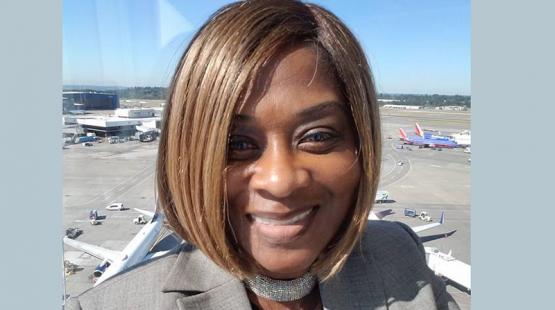Patricia Ly with Airport runway in background