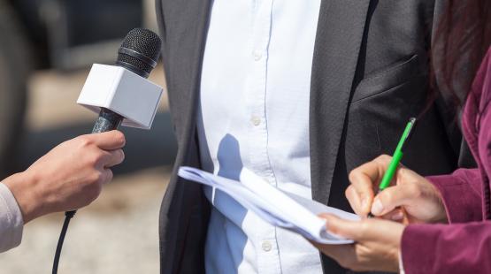 Media interview a man for a breaking news story