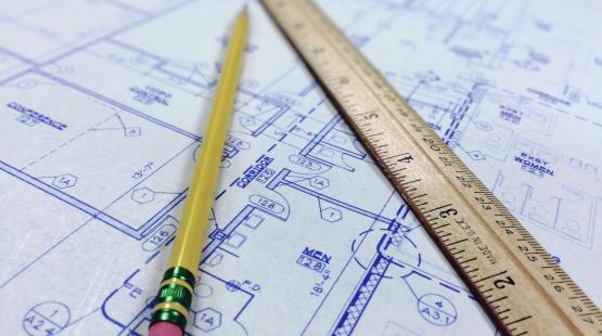 Pencil and ruler laying on a blueprint