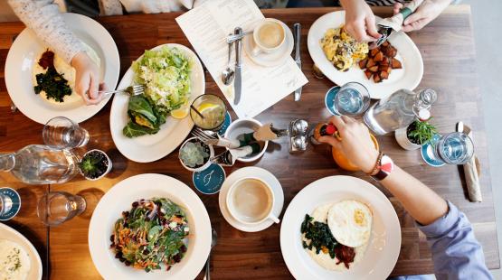 A table filled with plates of food.