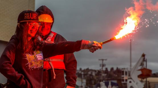Student learns about using a flare at the youth maritime expo, March 2018