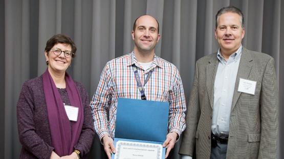 Perry Welch is recognized by Maritime Managing Director Stephanie Jones Stebbins and Chief Financial Officer Dan Thomas. 