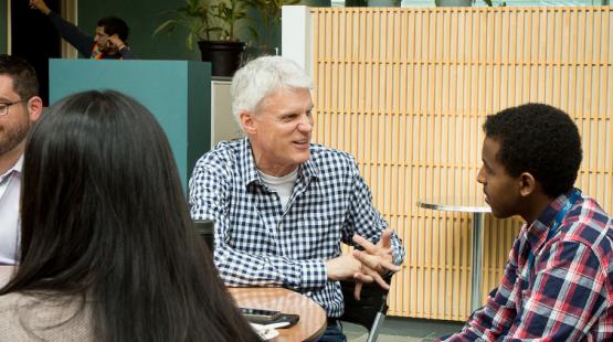 Dave Soike talking to an intern
