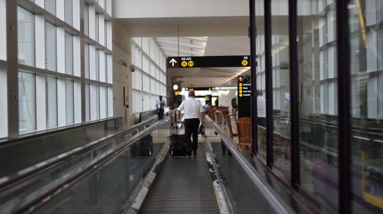 An Airport Employee on the moving walkways in A Gates