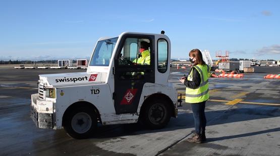 Chrissy O'brien, a Traffic Support Specialist, out on the airfield performing safety inspections as part of her PortAbility assignment.