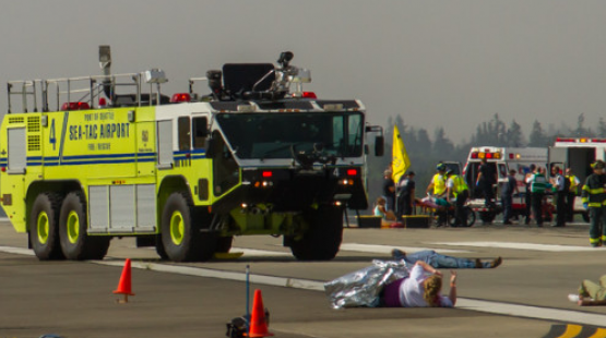 SEA fire truck and personnel exercise emergency response on the airfield.