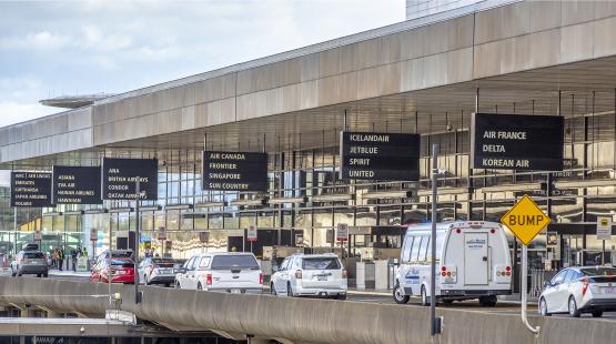 cars and shuttles on the departures drive of SEA Airport April 2021
