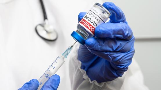 Doctor dispensing COVID-19 vaccine