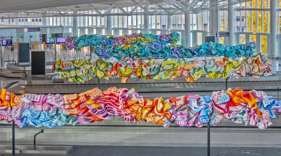 Colorful artwork by Marela Zacarias at the International Arrivals Facility Grand Hall Baggage Claim at SEA February 2022 