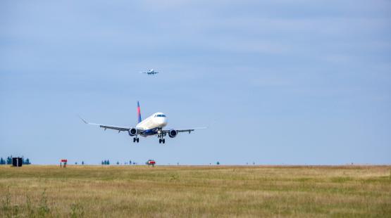 Aircraft taking off the runway.