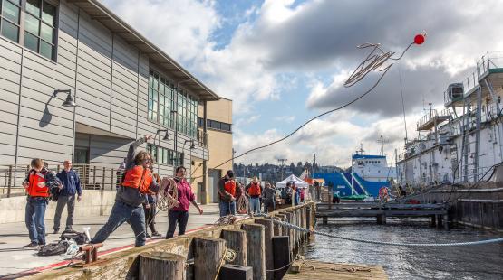 Maritime student throws a buoy at Seattle Maritime Academy