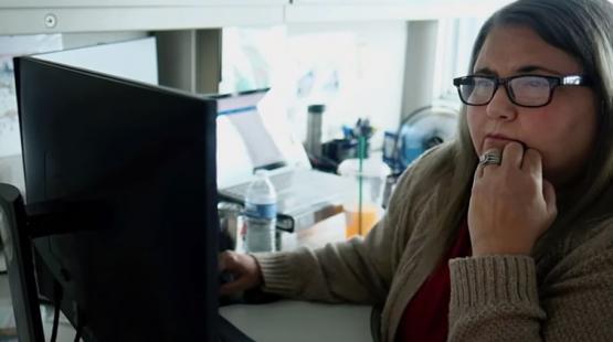 Cassie Fritz sitting at her computer
