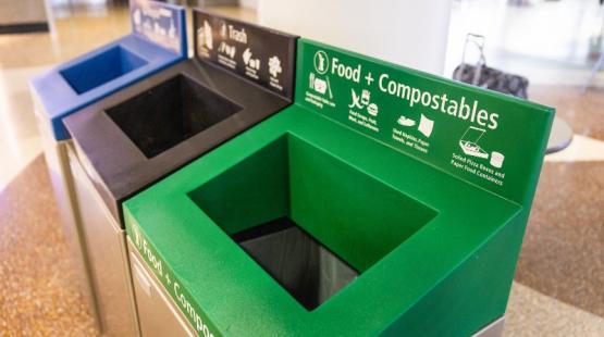 Photo of bins for compost, recycling, and garbage waste.