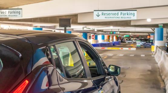 A car entering Reserved Parking in the SEA airport garage.