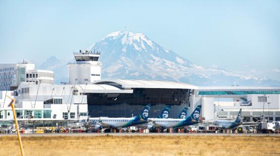 SEA Airport's airfield of the terminal with Mount Rainier in the background.