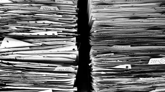 Stack of paper documents. 