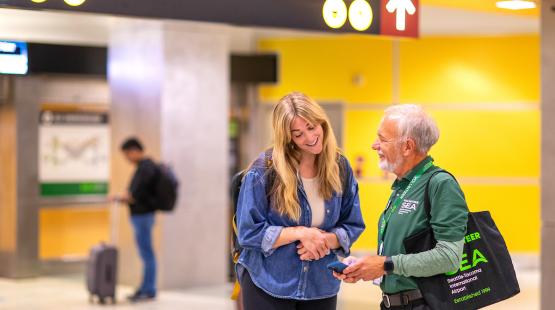 Volunteer helping a customer.