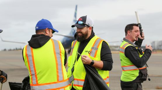 Airport Employees in High Vis Vests.
