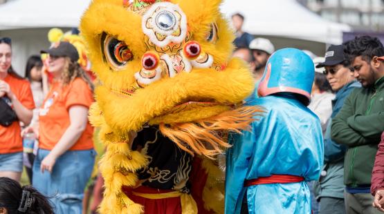 Community festival with Asian dragon costumes