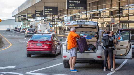 Passengers being dropped off at the terminal.